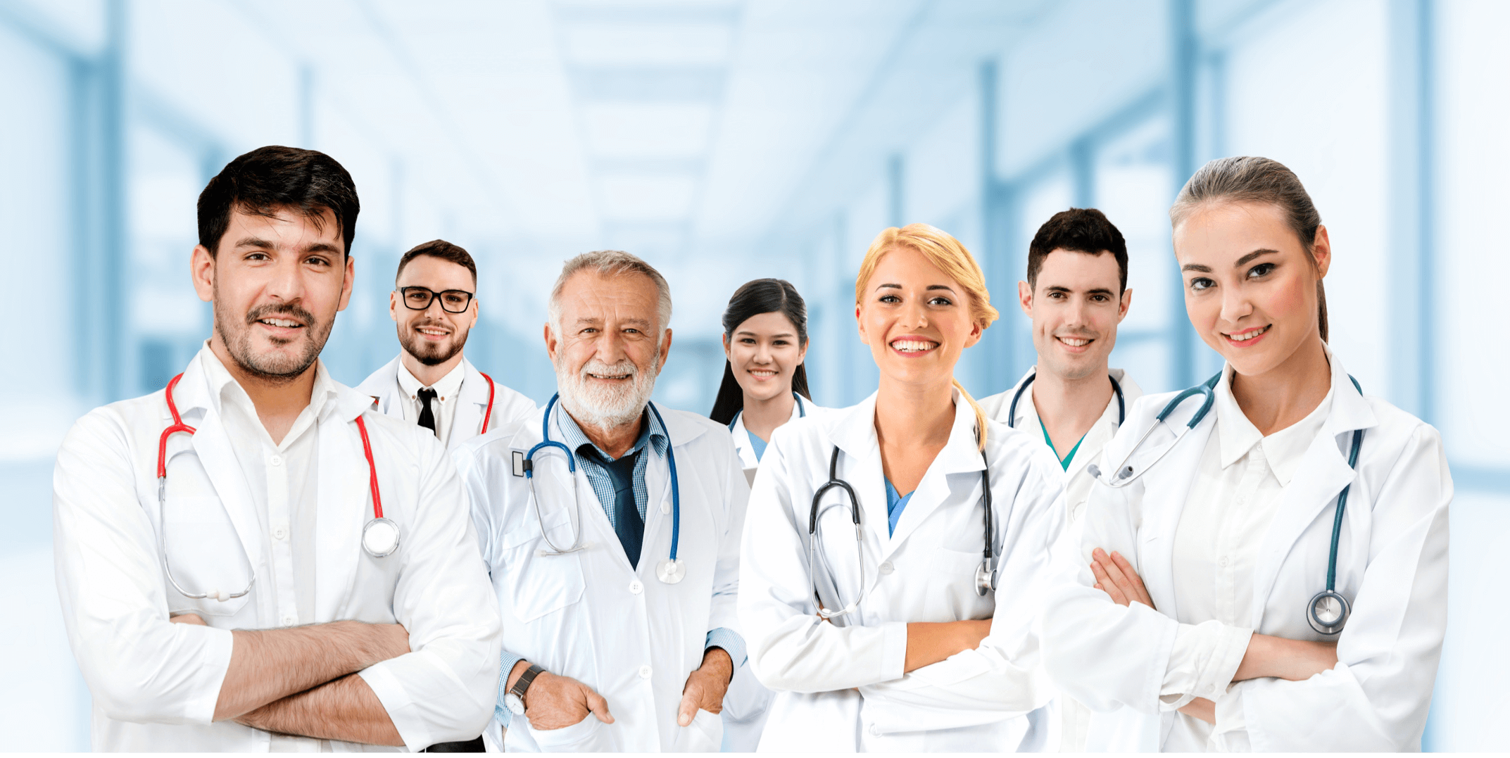 group of doctors in white coats smiling at the camera